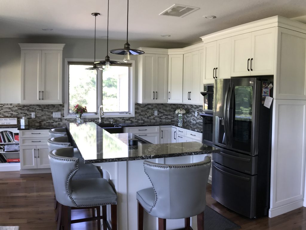 White kitchen with layered island
