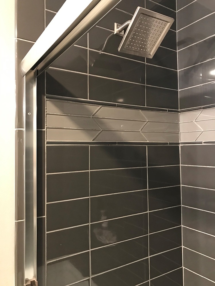 Stacked gray tile shower head
